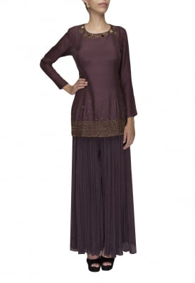 Wine short kurta with floral and tassel work paired with flared palazzo